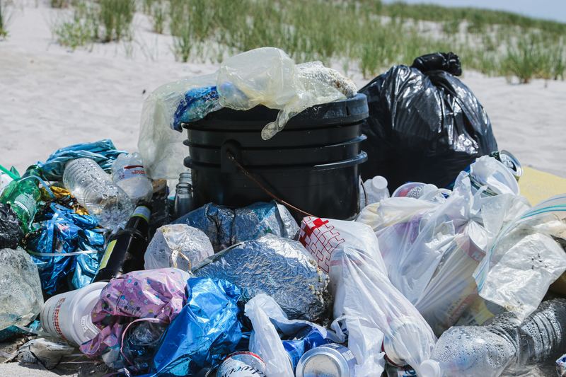 Volunteers&rsquo; haul of plastic bottles, bags and rope collected from a beach.